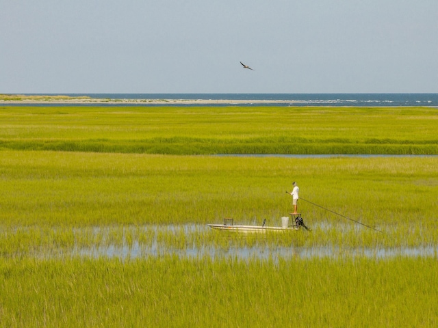 surrounding community featuring a water view