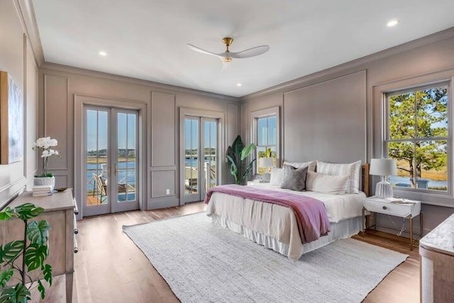 bedroom featuring crown molding, ceiling fan, access to exterior, and light hardwood / wood-style floors