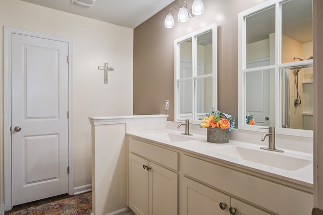 full bath featuring a sink, visible vents, and double vanity