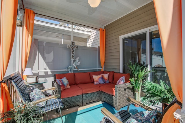 sunroom with a ceiling fan