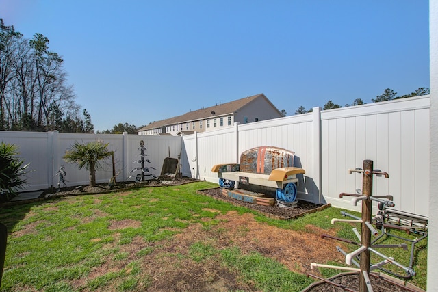 view of yard with a fenced backyard