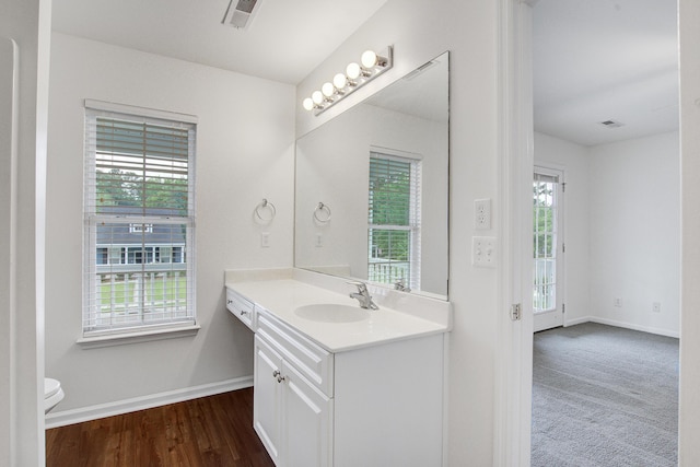 4818 Buttercup Way, Summerville, SC 29485 - bathroom with vanity, baseboards, toilet, and wood finished floors