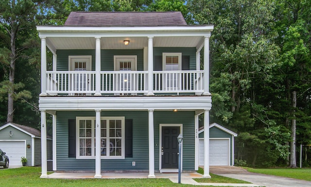 4818 Buttercup Way, Summerville, SC 29485 - view of front of home with a garage, covered porch, an outbuilding, and a balcony