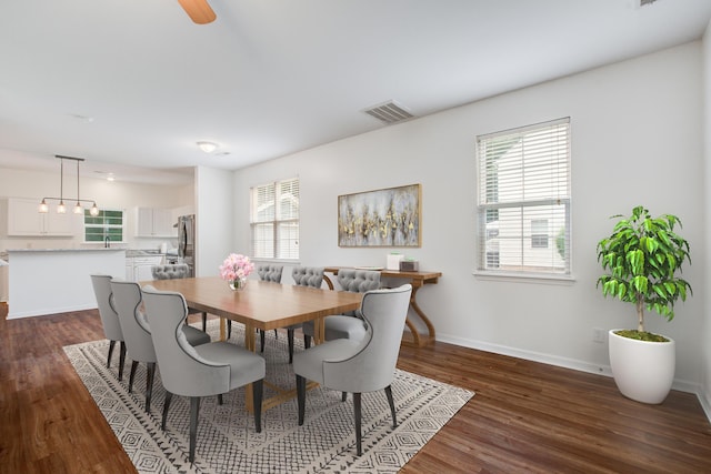 4818 Buttercup Way, Summerville, SC 29485 - dining area with dark wood-type flooring and baseboards