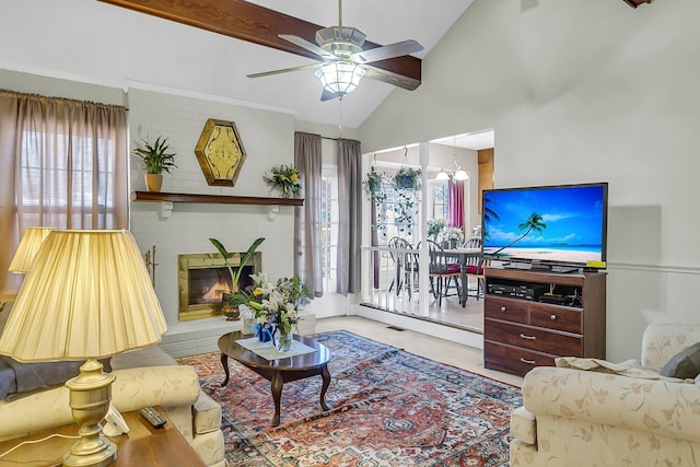 living room featuring vaulted ceiling, ceiling fan, and a fireplace