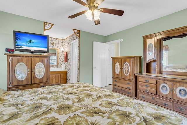 bedroom with ensuite bathroom and a closet