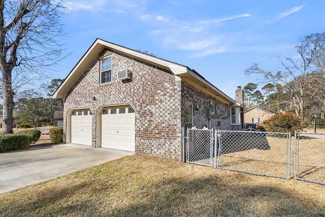 view of home's exterior with a garage, a wall unit AC, and a lawn