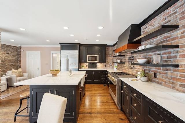 2 Bedons Aly, Charleston, SC 29401 - kitchen featuring premium appliances, open shelves, crown molding, wood finished floors, and light stone countertops