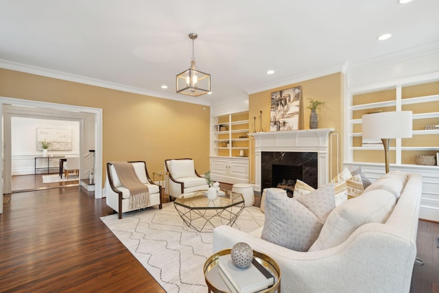 2 Bedons Aly, Charleston, SC 29401 - living area featuring built in features, dark wood-type flooring, crown molding, recessed lighting, and a premium fireplace