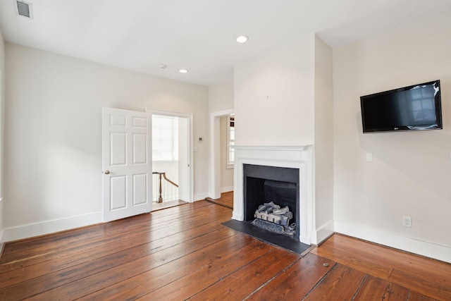 2 Bedons Aly, Charleston, SC 29401 - unfurnished living room with wood-type flooring, a fireplace, and recessed lighting