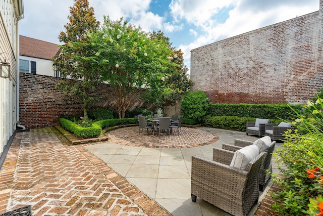 2 Bedons Aly, Charleston, SC 29401 - fenced backyard featuring a patio and outdoor dining area