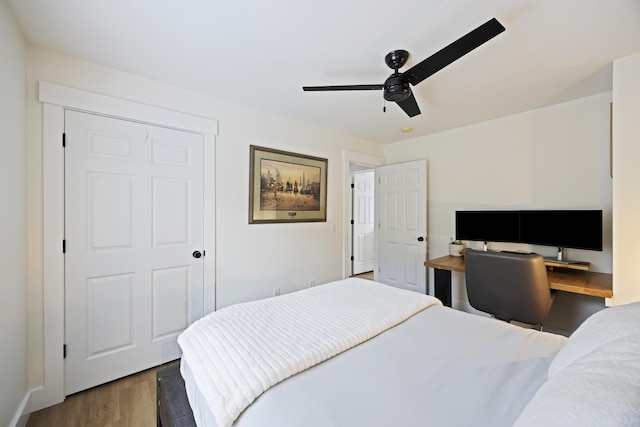 bedroom with a ceiling fan and wood finished floors