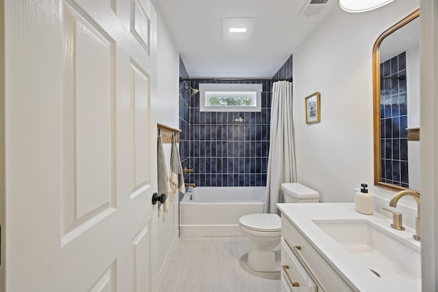 full bathroom with vanity, toilet, shower / bath combo, and visible vents