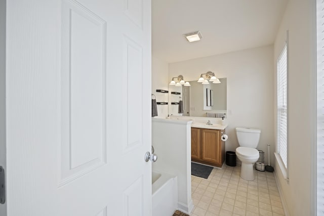 full bathroom with visible vents, a tub, baseboards, toilet, and vanity