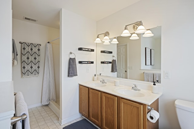 bathroom with a sink, visible vents, toilet, and a shower with curtain