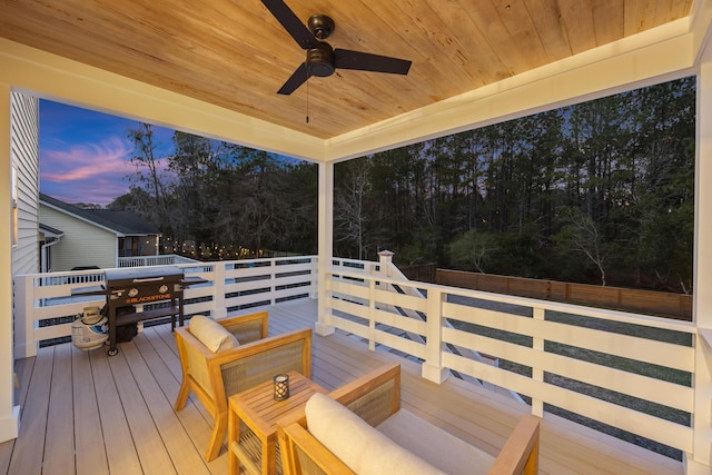 deck at dusk with a ceiling fan