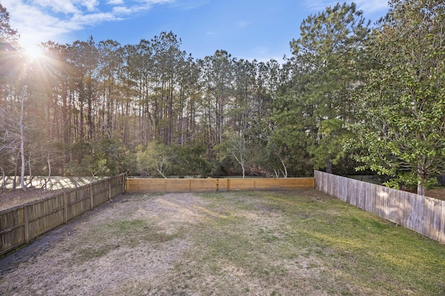 view of yard with a fenced backyard