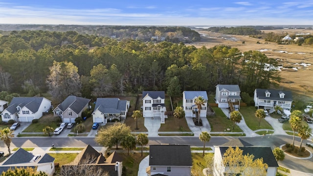 birds eye view of property featuring a residential view and a view of trees