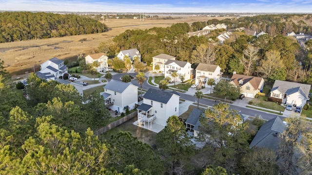 birds eye view of property featuring a residential view and a forest view