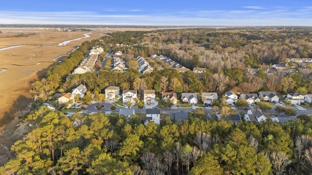 birds eye view of property with a residential view and a forest view