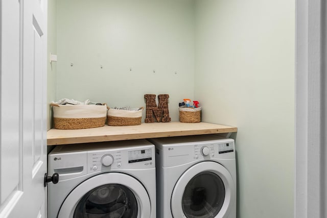 clothes washing area featuring laundry area and separate washer and dryer