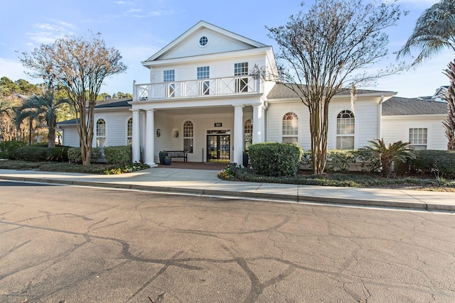 view of front of home featuring a balcony