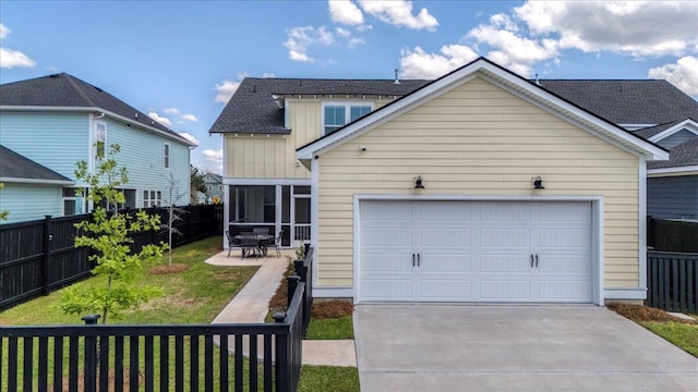 113 Grimball St, Summerville, SC 29486 - view of front of house featuring driveway, a sunroom, and a garage