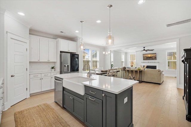 113 Grimball St, Summerville, SC 29486 - kitchen with refrigerator with ice dispenser, dishwasher, ornamental molding, gray cabinetry, and a sink