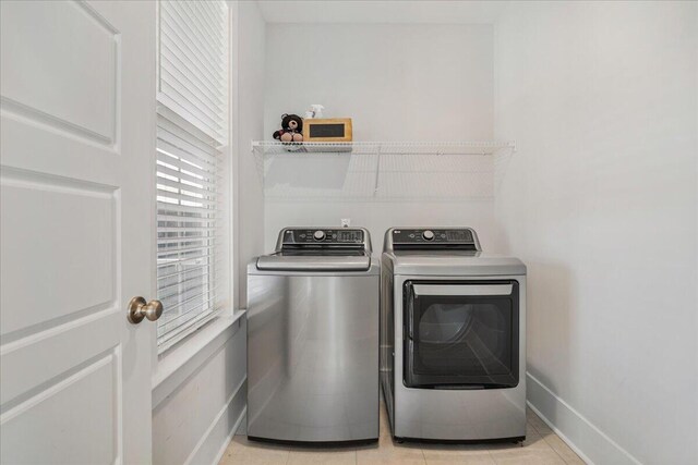 113 Grimball St, Summerville, SC 29486 - clothes washing area featuring separate washer and dryer, baseboards, and light tile patterned floors