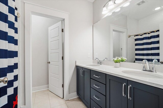 113 Grimball St, Summerville, SC 29486 - bathroom featuring tile patterned floors, double vanity, a shower with shower curtain, and baseboards