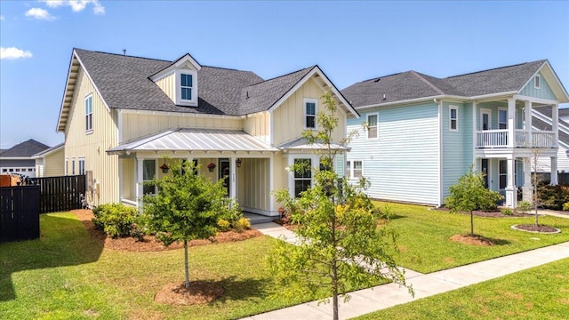 113 Grimball St, Summerville, SC 29486 - view of front of home featuring board and batten siding, roof with shingles, a standing seam roof, and a porch