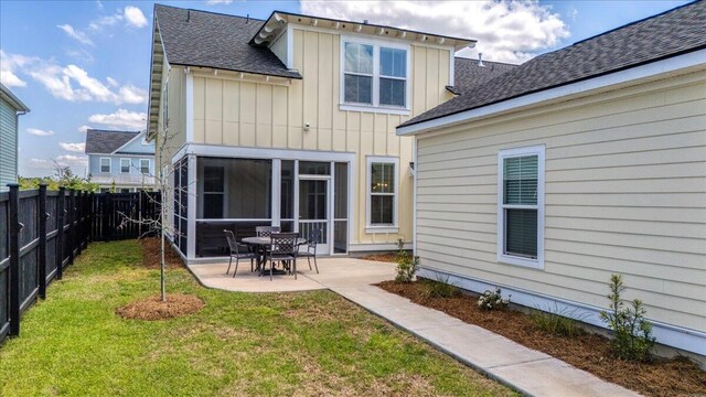113 Grimball St, Summerville, SC 29486 - back of property with board and batten siding, a patio area, and roof with shingles