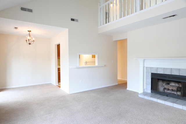 403 Sunny Side Way, Summerville, SC 29485 - unfurnished living room featuring a towering ceiling, carpet, a chandelier, a tile fireplace, and baseboards