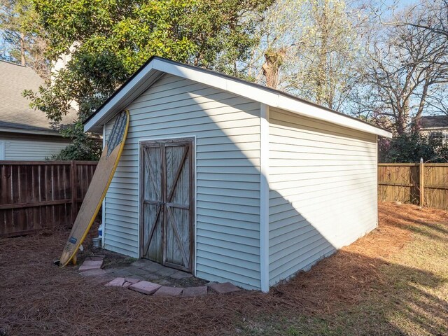 view of shed with a fenced backyard