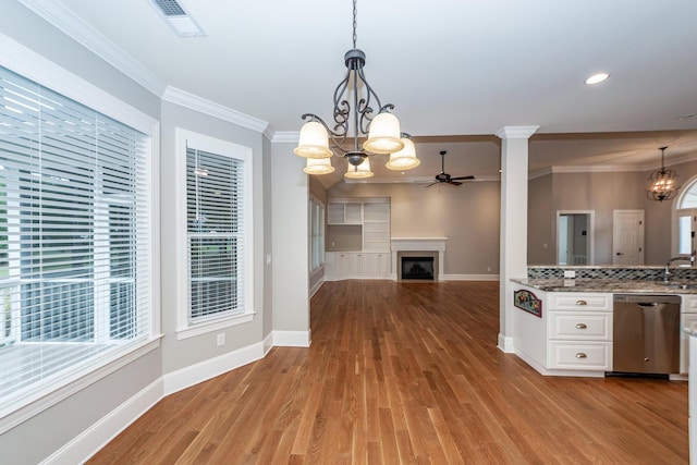 287 Commonwealth Rd, Mount Pleasant, SC 29466 - kitchen with baseboards, light wood-style flooring, ceiling fan with notable chandelier, and dishwasher