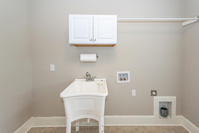 287 Commonwealth Rd, Mount Pleasant, SC 29466 - laundry area with washer hookup, hookup for an electric dryer, cabinet space, light tile patterned floors, and baseboards