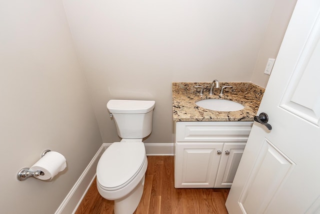 287 Commonwealth Rd, Mount Pleasant, SC 29466 - half bathroom with vanity, baseboards, wood finished floors, and toilet