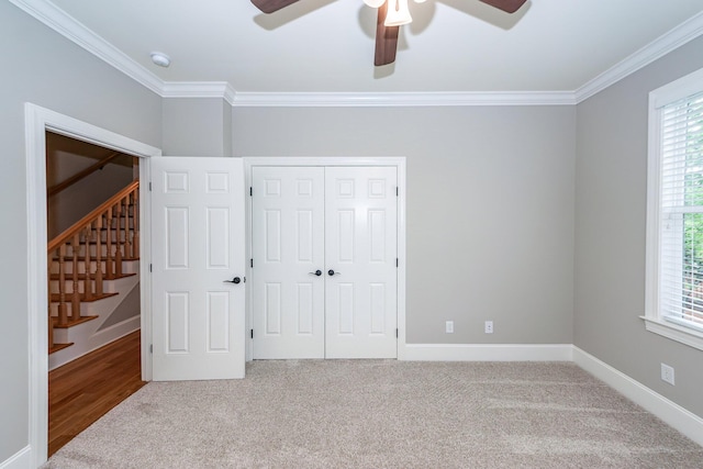 287 Commonwealth Rd, Mount Pleasant, SC 29466 - unfurnished bedroom with carpet, ornamental molding, multiple windows, and a closet