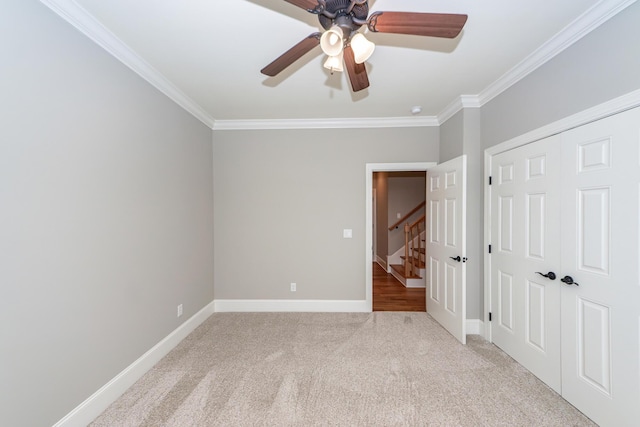 287 Commonwealth Rd, Mount Pleasant, SC 29466 - unfurnished bedroom featuring crown molding, ceiling fan, light colored carpet, baseboards, and a closet