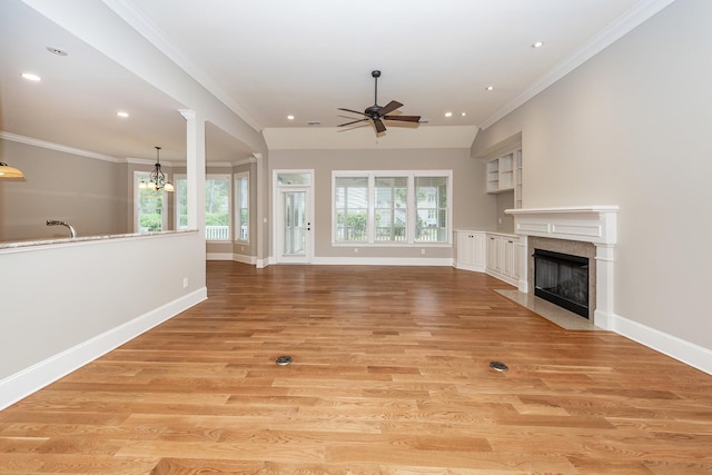 287 Commonwealth Rd, Mount Pleasant, SC 29466 - unfurnished living room featuring ornamental molding, a ceiling fan, and a wealth of natural light