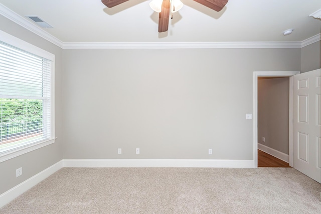 287 Commonwealth Rd, Mount Pleasant, SC 29466 - spare room featuring carpet flooring, crown molding, ceiling fan, baseboards, and visible vents