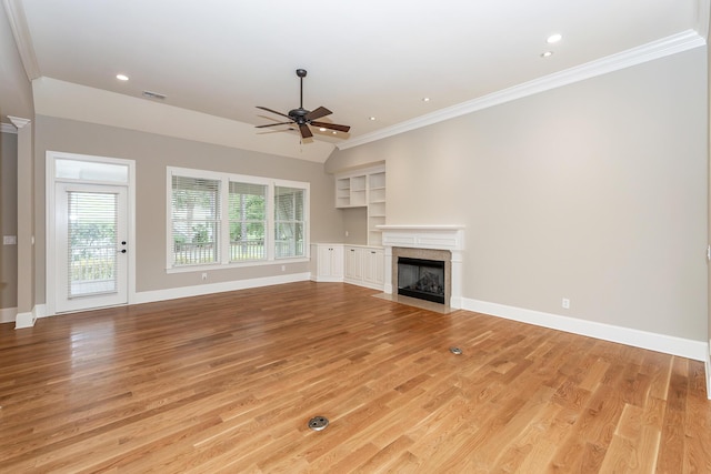 287 Commonwealth Rd, Mount Pleasant, SC 29466 - unfurnished living room with ceiling fan, visible vents, crown molding, a fireplace with flush hearth, and light wood-style floors