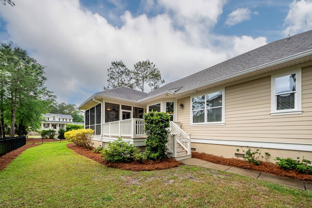 287 Commonwealth Rd, Mount Pleasant, SC 29466 - back of property featuring fence, roof with shingles, a sunroom, crawl space, and a lawn