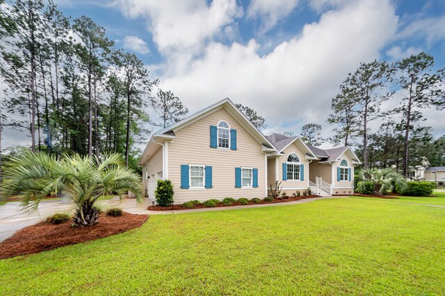 287 Commonwealth Rd, Mount Pleasant, SC 29466 - view of front of house with a garage, concrete driveway, and a front yard