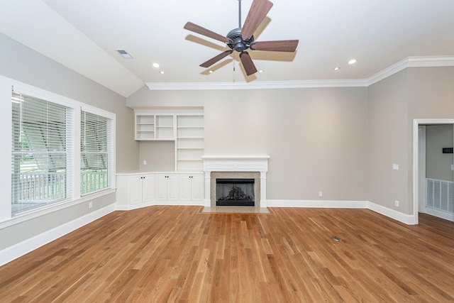 287 Commonwealth Rd, Mount Pleasant, SC 29466 - unfurnished living room featuring a fireplace with flush hearth, crown molding, light wood-style flooring, and visible vents