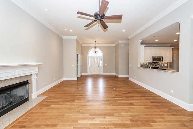 287 Commonwealth Rd, Mount Pleasant, SC 29466 - unfurnished living room with a ceiling fan, a fireplace with flush hearth, baseboards, recessed lighting, and light wood-style flooring