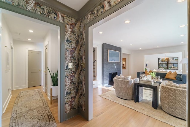 interior space with a large fireplace and light hardwood / wood-style flooring