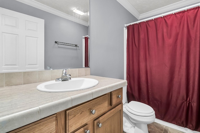 bathroom with vanity, tile patterned floors, crown molding, toilet, and a textured ceiling