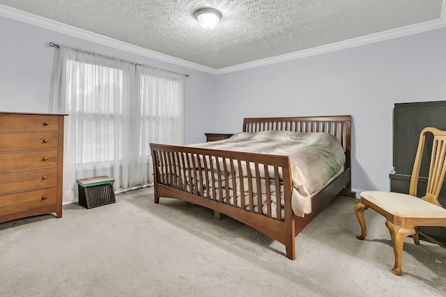 bedroom featuring a textured ceiling, light colored carpet, and ornamental molding