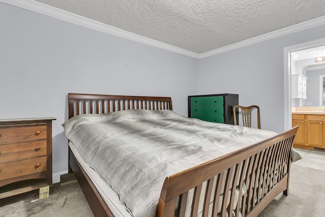 bedroom with a textured ceiling, connected bathroom, light colored carpet, and ornamental molding